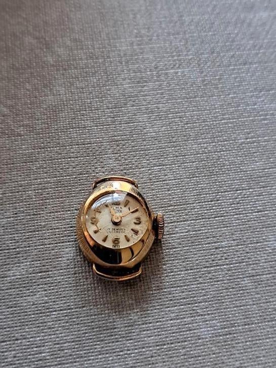 een oud klein horloge elma ancre swiss, Antiek en Kunst, Ophalen of Verzenden