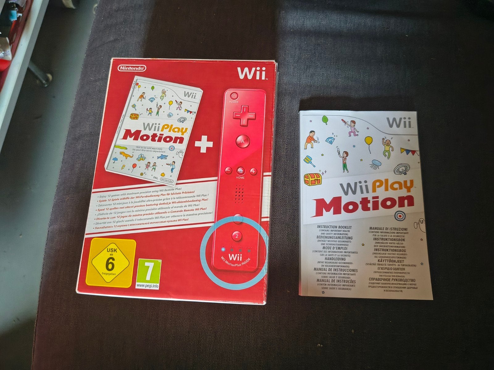 Box van rode Wii motion plus+ handieiding(zonder controller), Games en Spelcomputers, Spelcomputers | Nintendo Wii, Ophalen of Verzenden