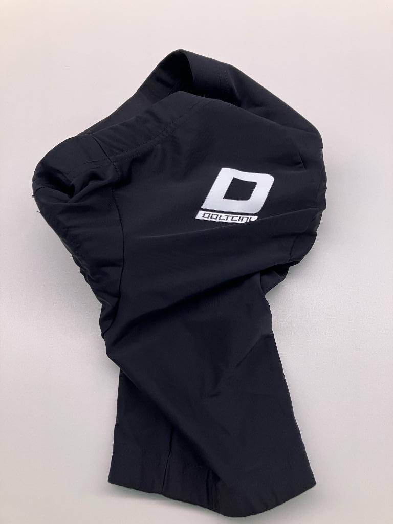 Zwarte koersbroek doltcini kinderen +/- 10 jaar (nieuwstaat), Vêtements d'extérieur, Enlèvement ou Envoi, Comme neuf, Doltcini