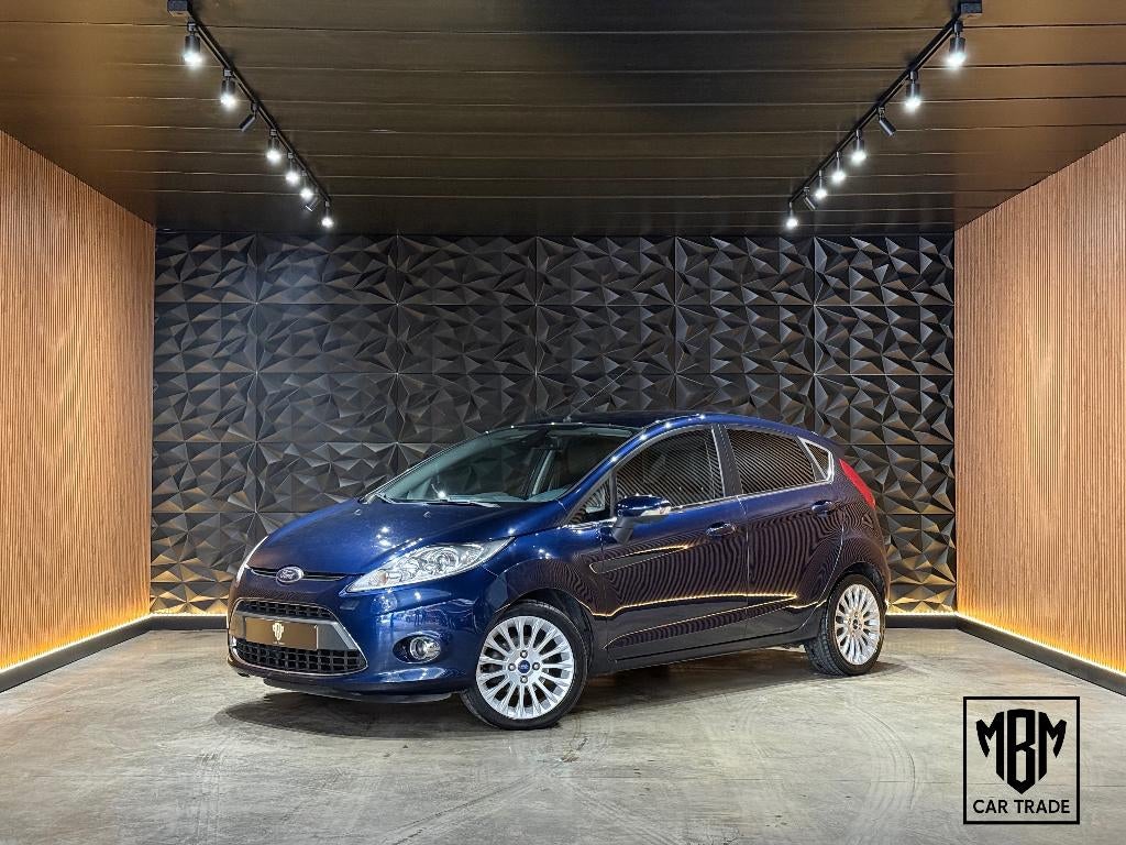 ✅Ford Fiesta 1.2i Titanium GARANTIE Airco Parksensoren 1.Eig, Auto's, Voorwielaandrijving, Euro 5, Stof, 4 cilinders