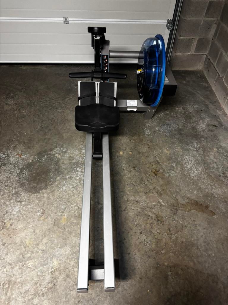 Rameur E-520 Fluid, Sports & Fitness, Appareils de fitness, Comme neuf, Rameur, Métal, Enlèvement