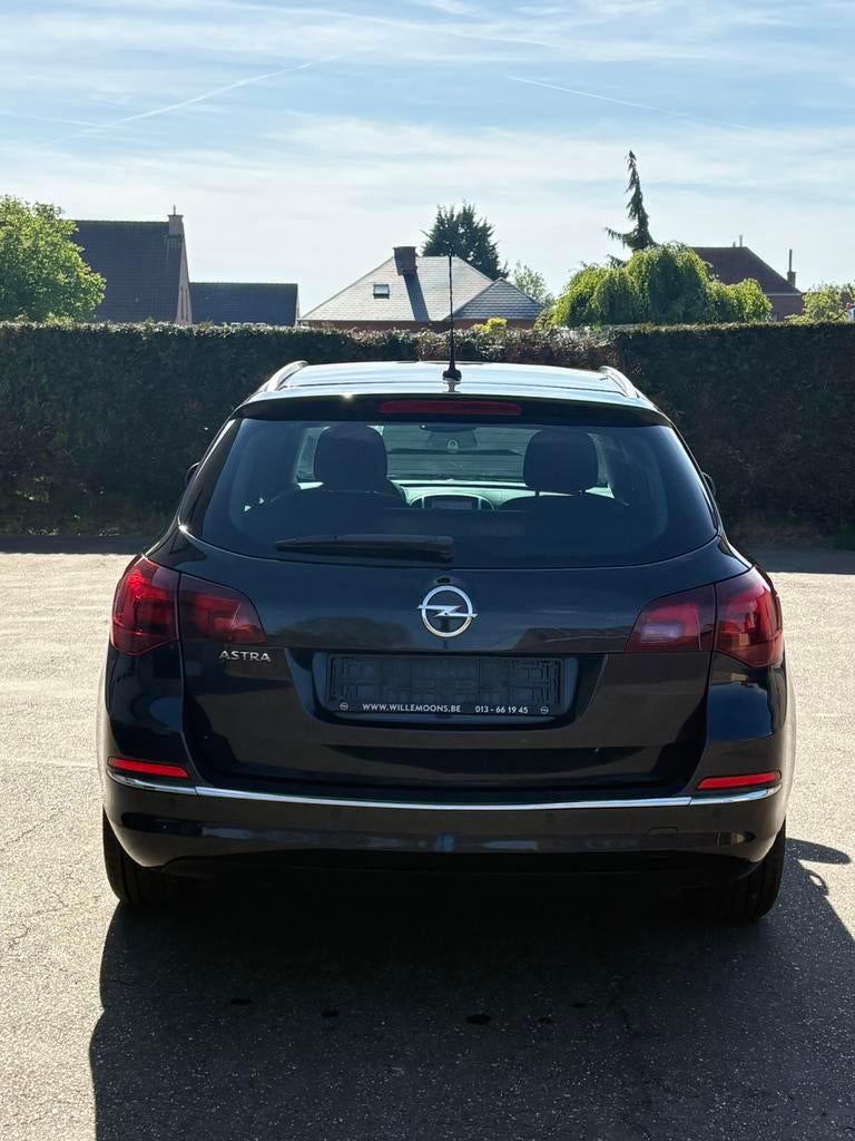 Opel Astra Sports Tourer 1.4 Benzine (2015), Auto's, Euro 5, 139 g/km, 1384 cc, Zwart