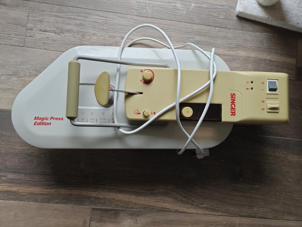 Singer strijkpers te koop, Ophalen
