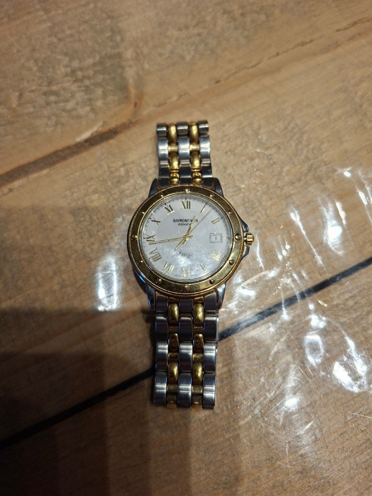 Horloge raymond weil tango, Ophalen