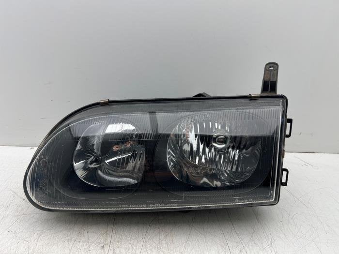 Koplamp links van een Mitsubishi L400, Gebruikt, -, -, Ophalen of Verzenden