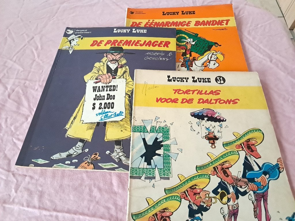 Strips Luckey Luke, Dan Cooper en Alain Chevalier, Boeken, Stripverhalen, Meerdere stripboeken, Ophalen of Verzenden, Gelezen
