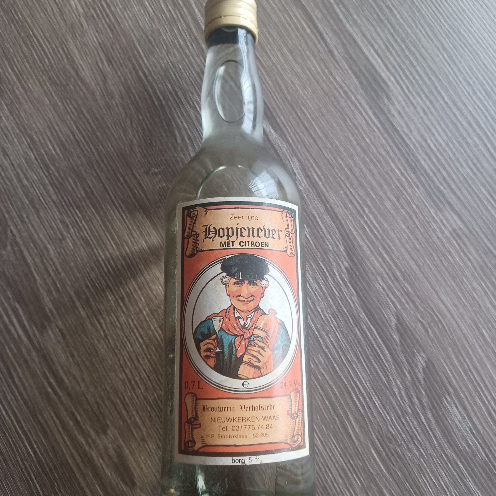 oude fles hopjenever met citroen van brouwerij Verhofstede, Ophalen, Zo goed als nieuw, Flesje(s)