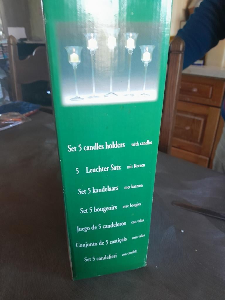 5 kandelaars met kaarsen, Ophalen