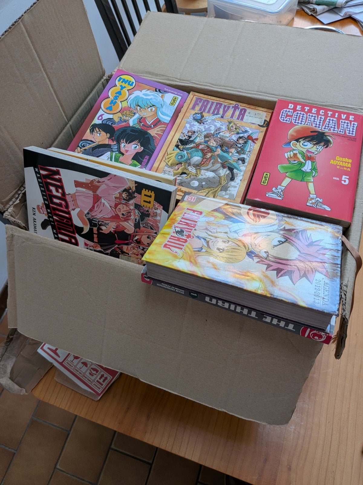 lot met 60 manga, Ophalen