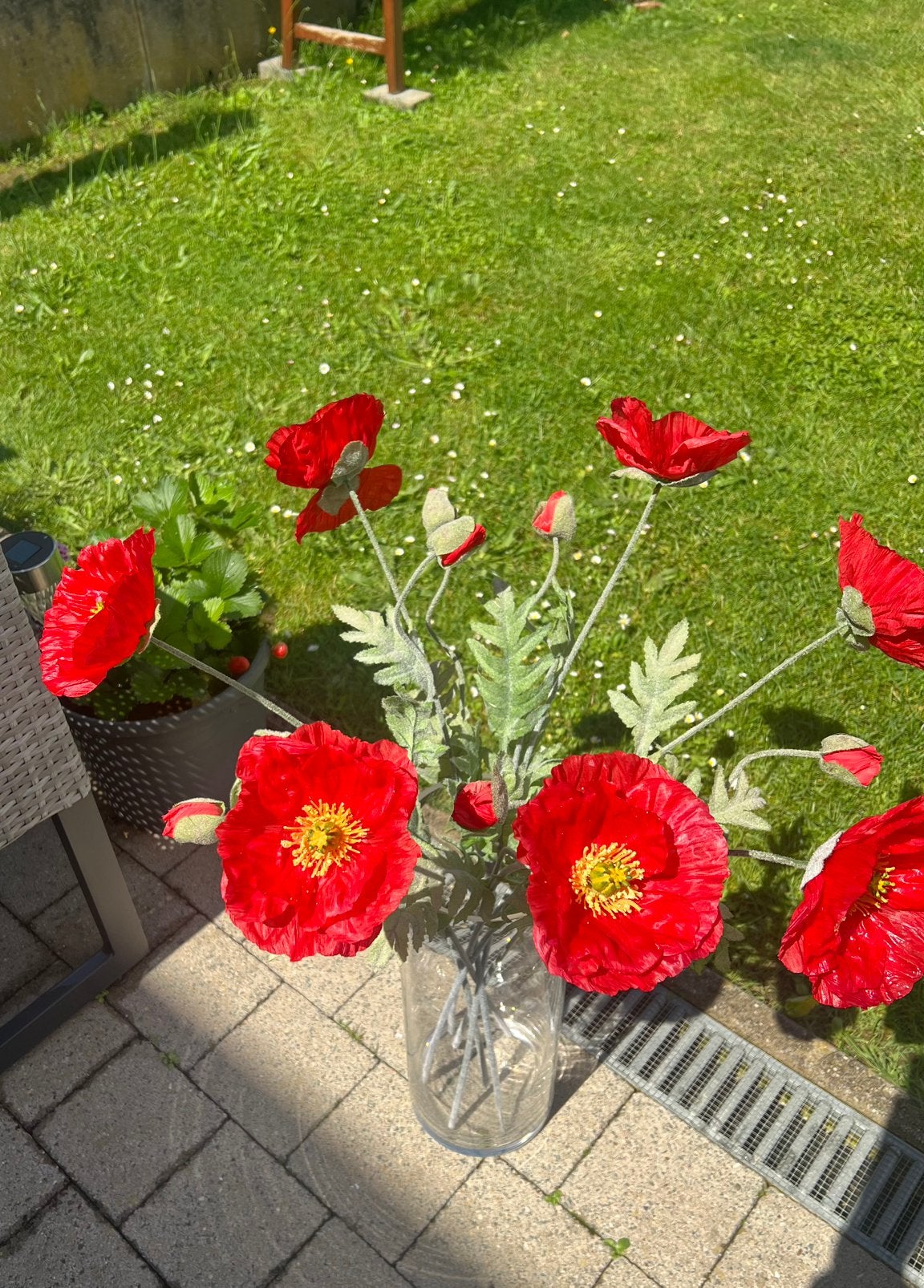 Te koop vaas met bloemen, Ophalen