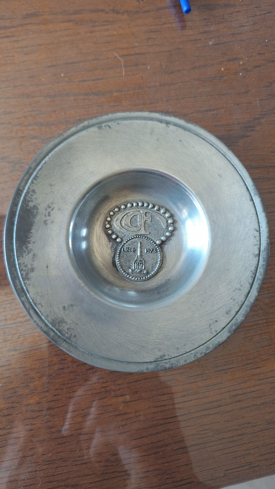 Assiette en étain des Postainiers hutois, Enlèvement