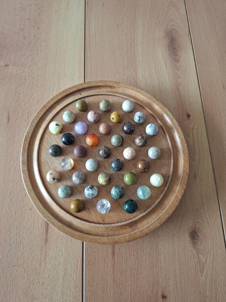 Uniek solitaire bordspel # marmeren knikkers, Ophalen