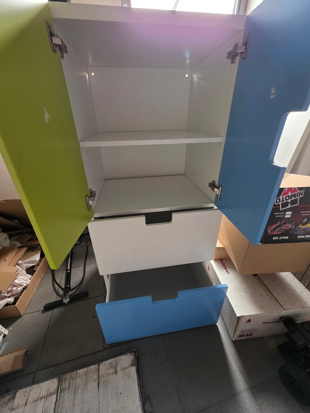 IKEA kast met liggers en schuiven, Ophalen
