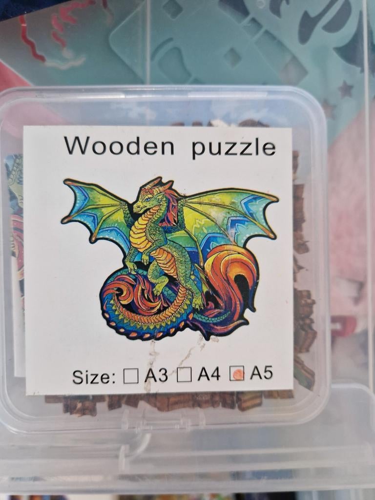 Houten puzzel draak, Ophalen
