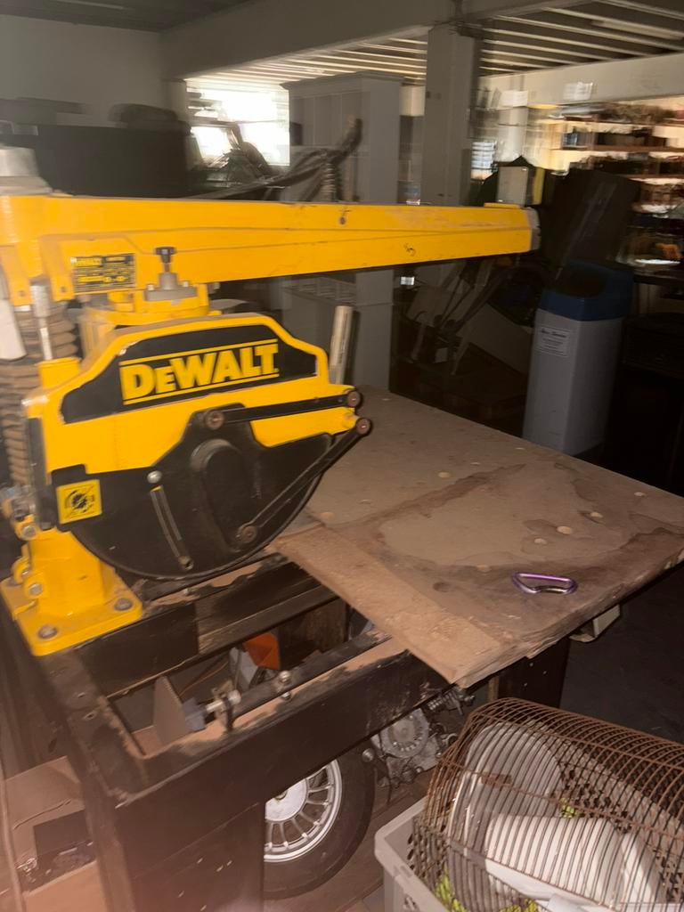 Radiale tafelzaag DeWalt, Ophalen