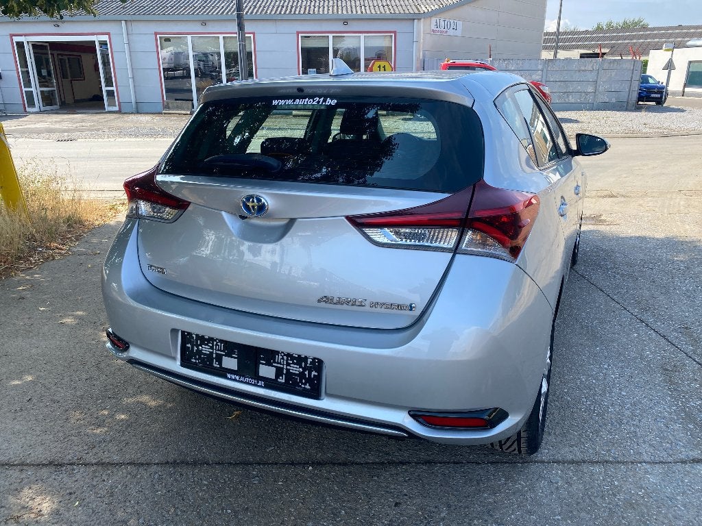 Toyota Auris HEV 1.8i HSD Dynamic E-CVT, Auto's, Dealer onderhouden, Stof, 4 cilinders, Bedrijf
