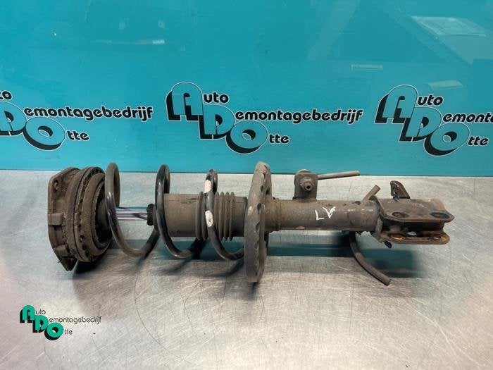 Schokdemperpoot links-voor van een Nissan Micra (Micra 03-), Gebruikt, -, -, Ophalen of Verzenden