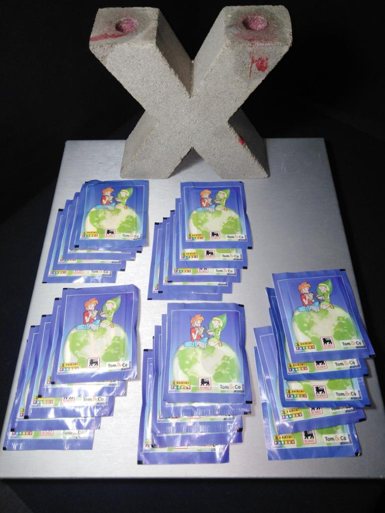 Lot de 25 pochettes Panini CROQUE LE MONDE Delhaize Tom&Co 2, Autres supermarchés, Enlèvement ou Envoi