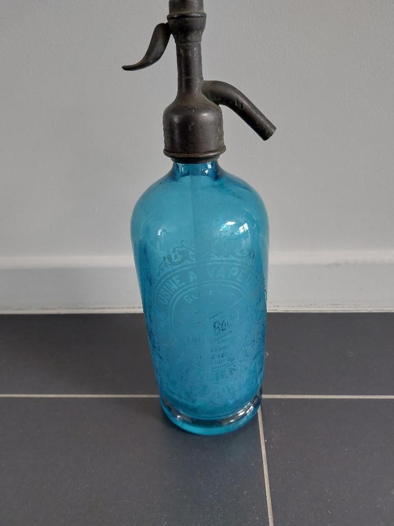 Oude spuitwaterflessen, Ophalen