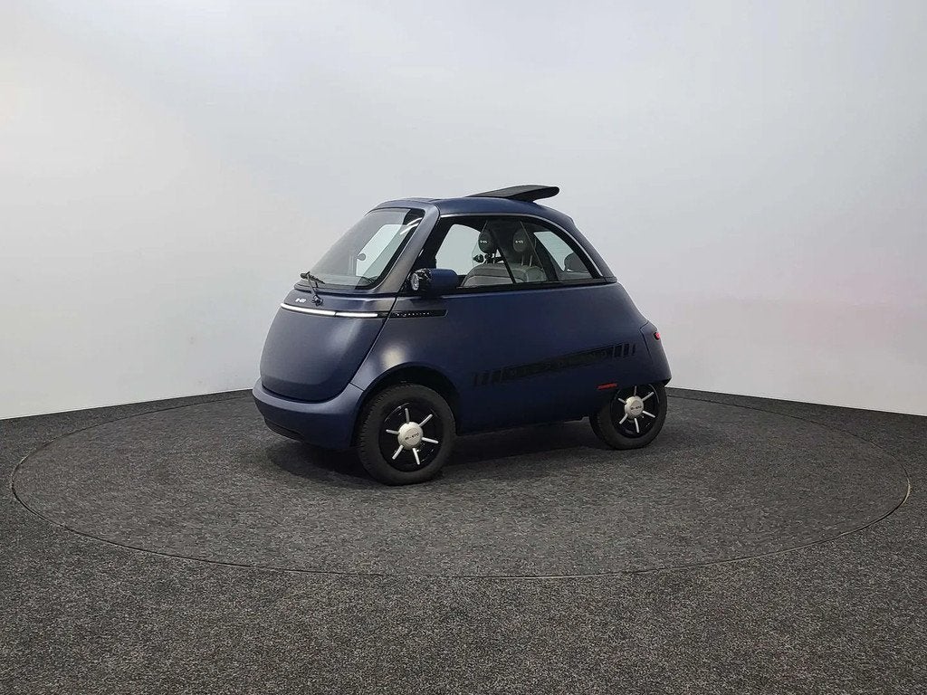 MICRO Microlino B RIJBEWIJS | 10.5 kWh | BTW Wagen | 90km/h, Auto's, Stof, Zwart, 12 kW, Nieuw