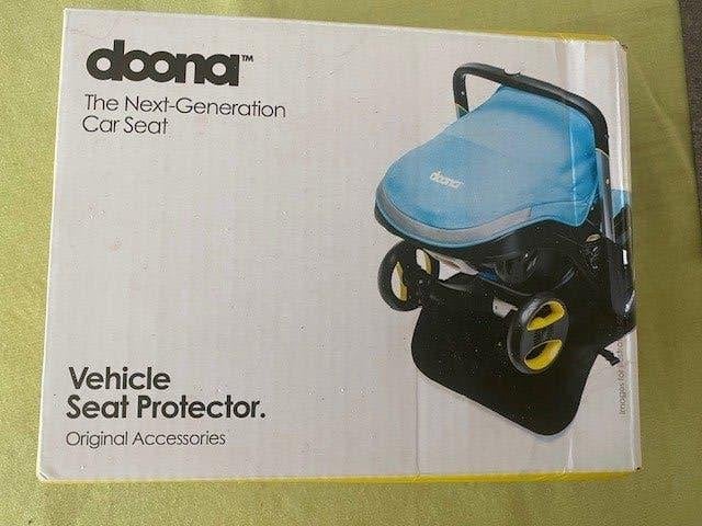 NIEUW   DOONA  Seatprotector - zetelbeschermer, Neuf, Autres marques, Enlèvement ou Envoi, Ceinture de sécurité ou Isofix