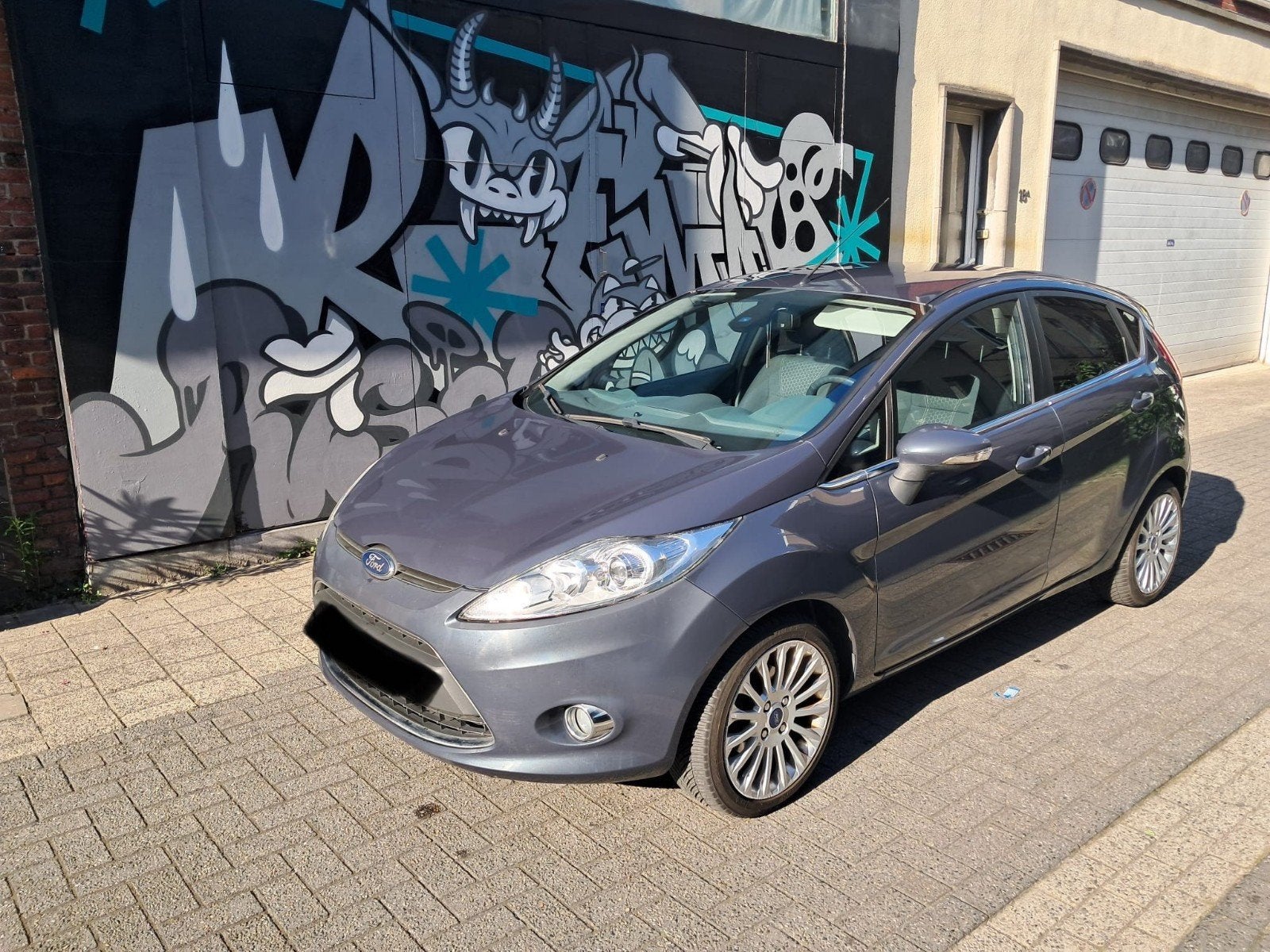 Ford Fiësta 1.4i met 115000km AUTOMAAT Titanium uitvoering, Auto's, Automaat, Euro 5, Zwart, Blauw