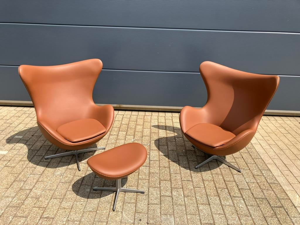 2x Fritz Hansen Egg Chair + Ottoman Cognac leder NIEUWstaat!, Ophalen of Verzenden, Cassina togo tecno sede b&b italia knoll vitra leolux artifort