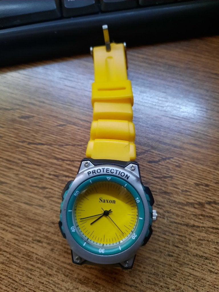 Saxon horloge "Protection" - Vintage, Handtassen en Accessoires, Horloges | Heren, Overige merken, Staal, Polshorloge, Kunststof