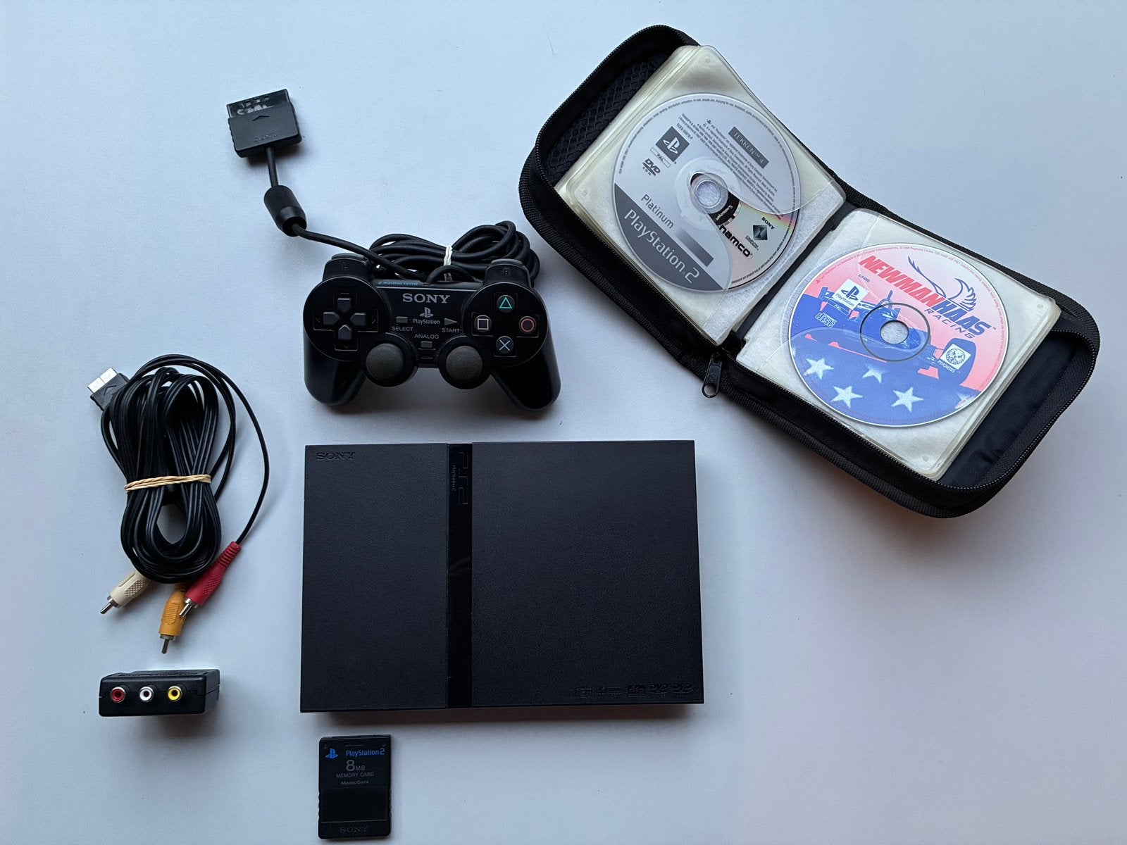 PS2 Slim met retro PS1 opbergmap en 14 games (7 PS2, 7 PS1), Ophalen of Verzenden, Zo goed als nieuw, Slim