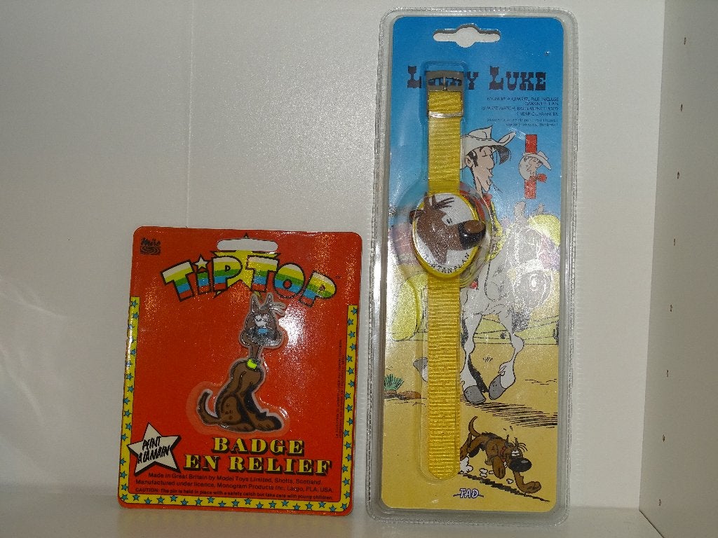 ot Lucky Luke - Montre Rantanplan TAD 1995 + Badge Relief, Enlèvement ou Envoi, Autres personnages, Comme neuf, Statue ou Figurine
