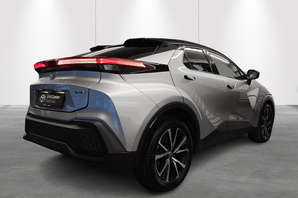 Toyota C-HR 1.8 Hybrid Dynamic Plus Bi-Tone E-CVT + Techno P, Auto's, Stof, Zwart, 4 cilinders, 5 zetels