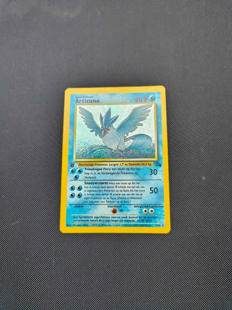 Pokemon Articuno 1st edition fossil Nederlands, Ophalen of Verzenden, Zo goed als nieuw, Losse kaart, Foil