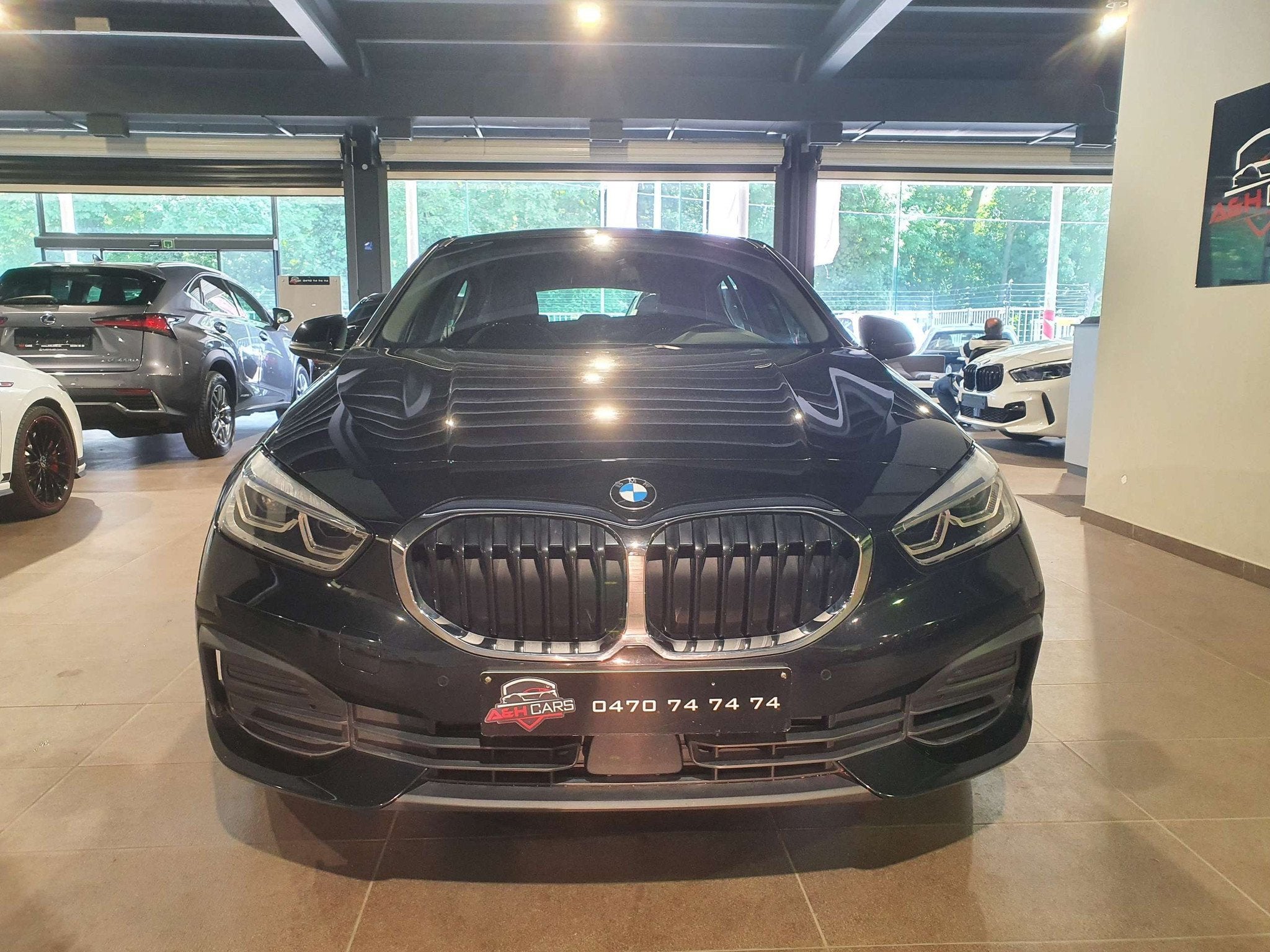 BMW 1 Serie 118 118iA OPF (bj 2019, automaat), Auto's, Gebruikt, Zwart, Bedrijf, 5 deurs