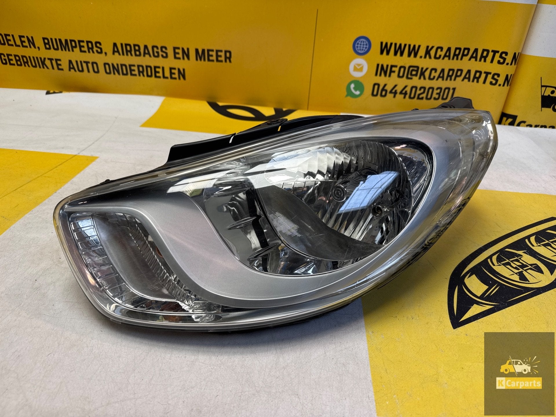 Hyundai i10 links voor koplamp origineel LHD13002 koplamp, Info@fabrikant.eu, Fabrikantstraat 1
1000 AA  Amsterdam, NL, Hyundai