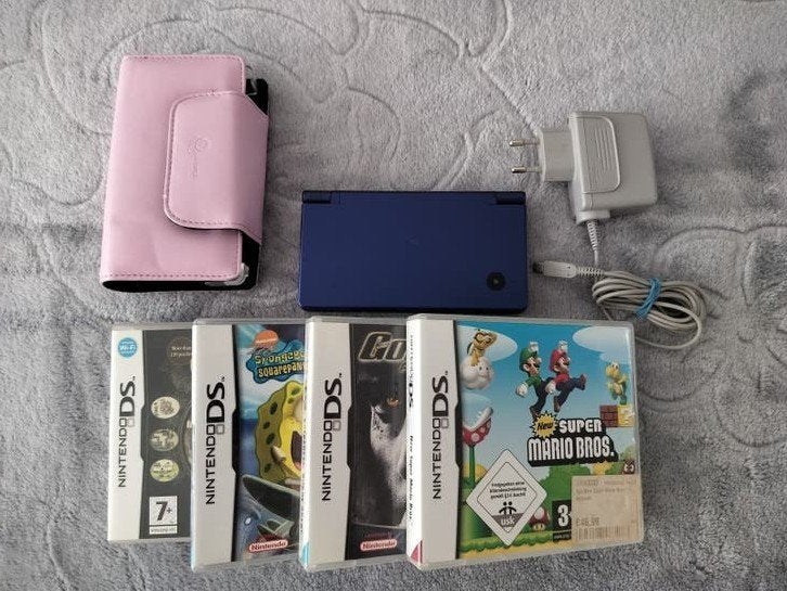 Blauwe Nintendo DSi-console + oplader + hoesje + set van 4 D, Games en Spelcomputers, Spelcomputers | Nintendo DS, Ophalen, Blauw