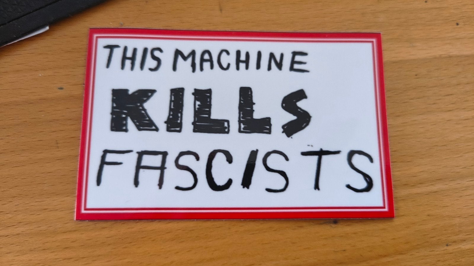 "This machine kills fascists" sticker