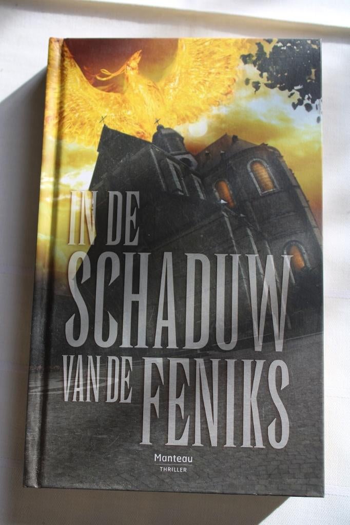 Manteau - Stan Lauryssens - In de schaduw van de feniks, Boeken, Gelezen, België, Ophalen of Verzenden, Stan Lauryssens