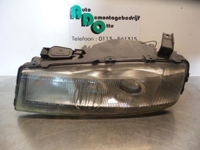 Phare gauche d'un Opel Calibra (Calibra 90-), -, Opel, 3 mois de garantie, Utilisé