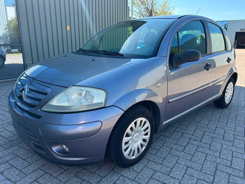Citroen C3 1.4 benzine bouwjaar 2006 142000 km goede staat, Voorwielaandrijving, Stof, Zwart, 4 cilinders