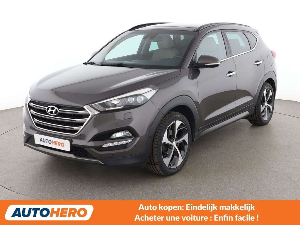 Hyundai Tucson 1.6 TGDI Advantage 4WD (bj 2016, automaat), Auto's, Hyundai, Automaat, Gebruikt, Bruin, Leder
