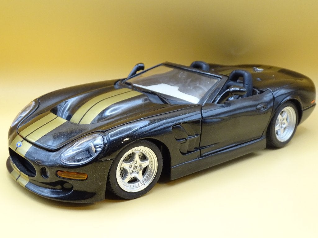Shelby Series 1 1:18 Bburago Black-Gold Edition, Hobby & Loisirs créatifs, Voitures miniatures | 1:18, Enlèvement ou Envoi, Comme neuf