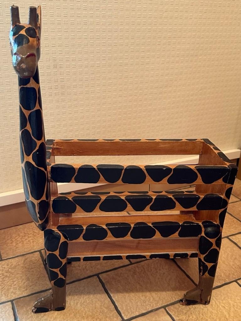 Porte-journaux girafe, Ophalen