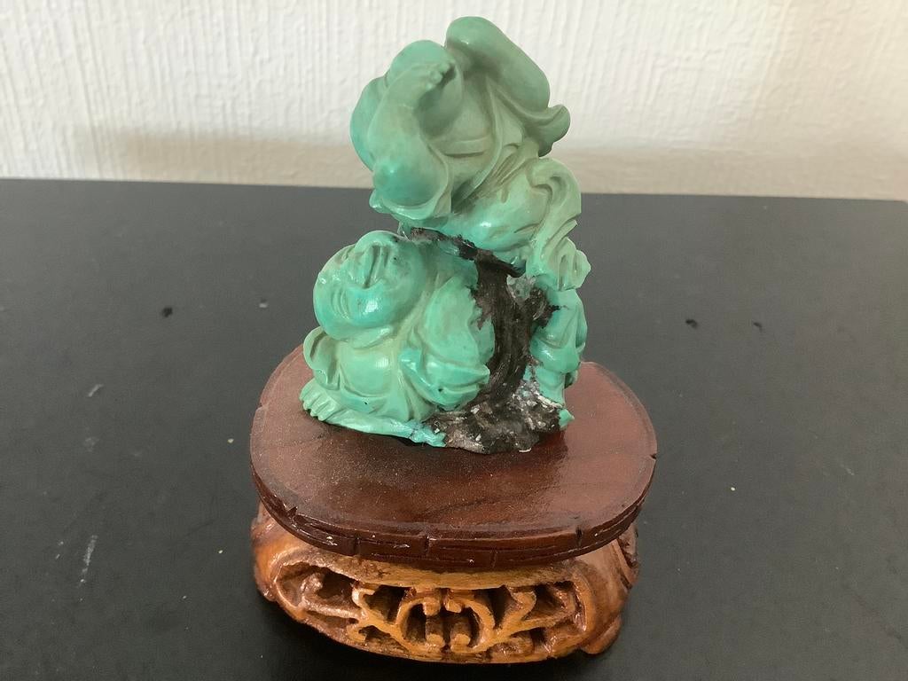 2 spelende budda’s in turkoois op sokkel, Enlèvement