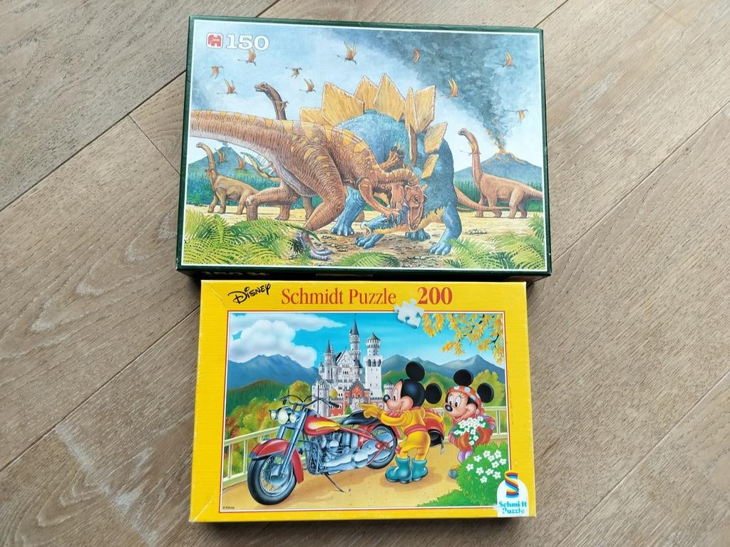 2X puzzels dino's 150 stukjes. Mickey mouse 200 stukjes, Ophalen of Verzenden