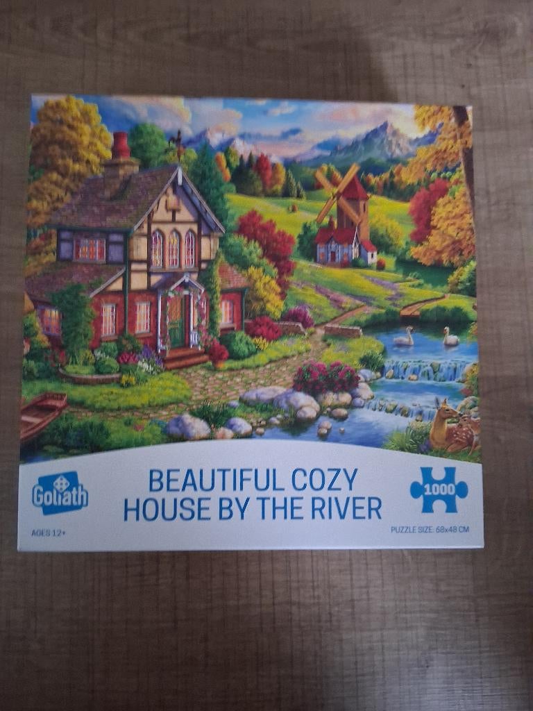 Goliath puzzel 1000 stukjes cosy house by the river, Hobby en Vrije tijd, Gezelschapsspellen | Bordspellen, Een of twee spelers