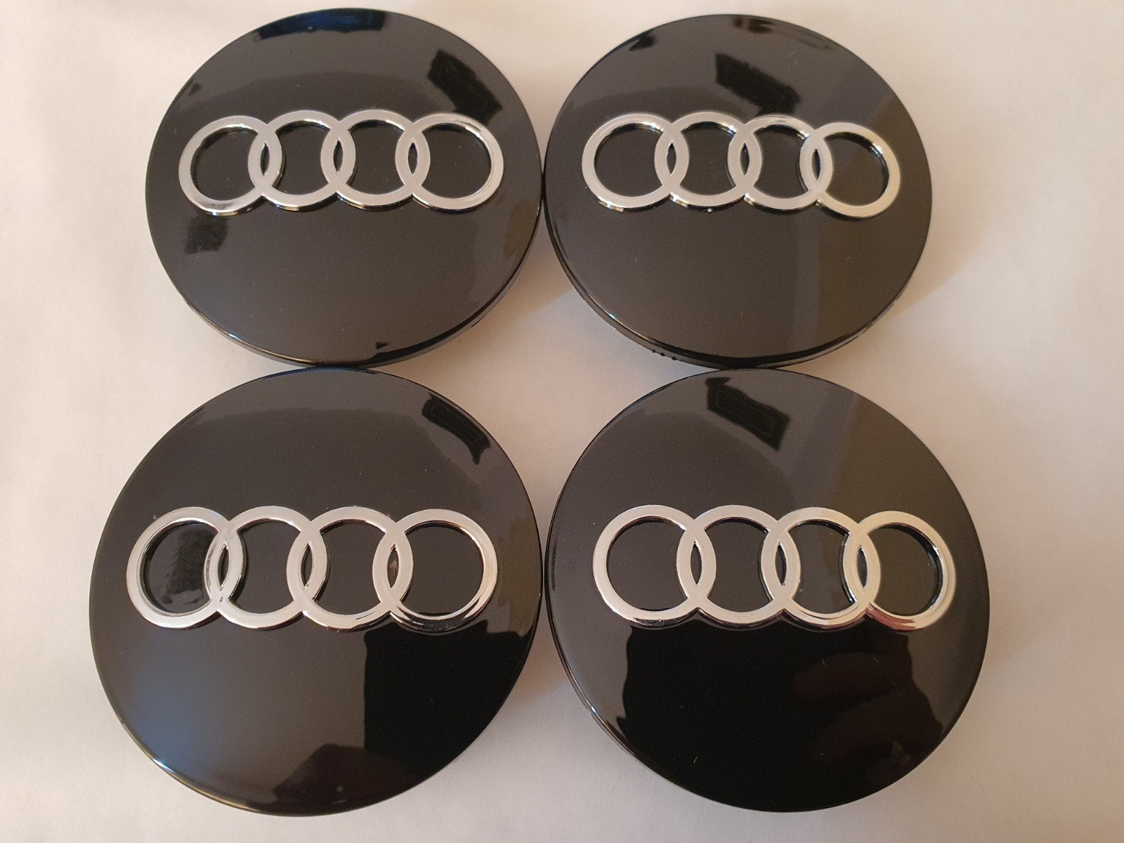 Couvre-jantes Audi noirs, diamètre extérieur 69 mm, Enlèvement ou Envoi, Neuf