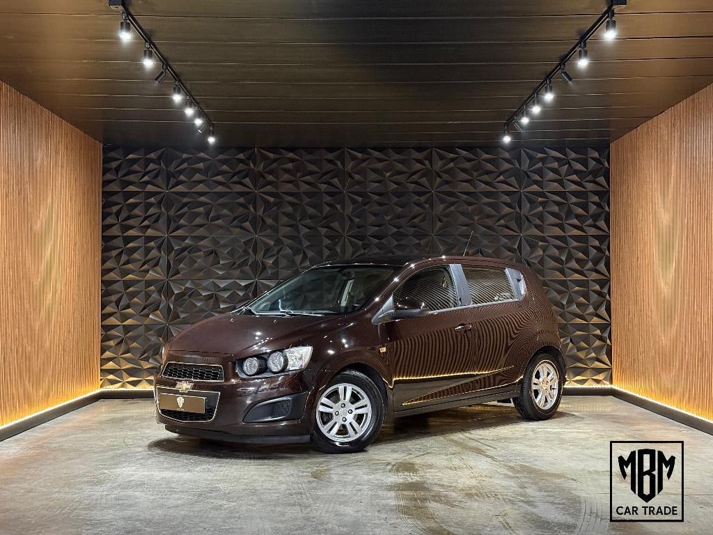 ✅ Chevrolet Aveo 1.2i 12 Maand GARANTIE Airco Cruise Control, Voorwielaandrijving, Euro 5, Stof, 4 cilinders