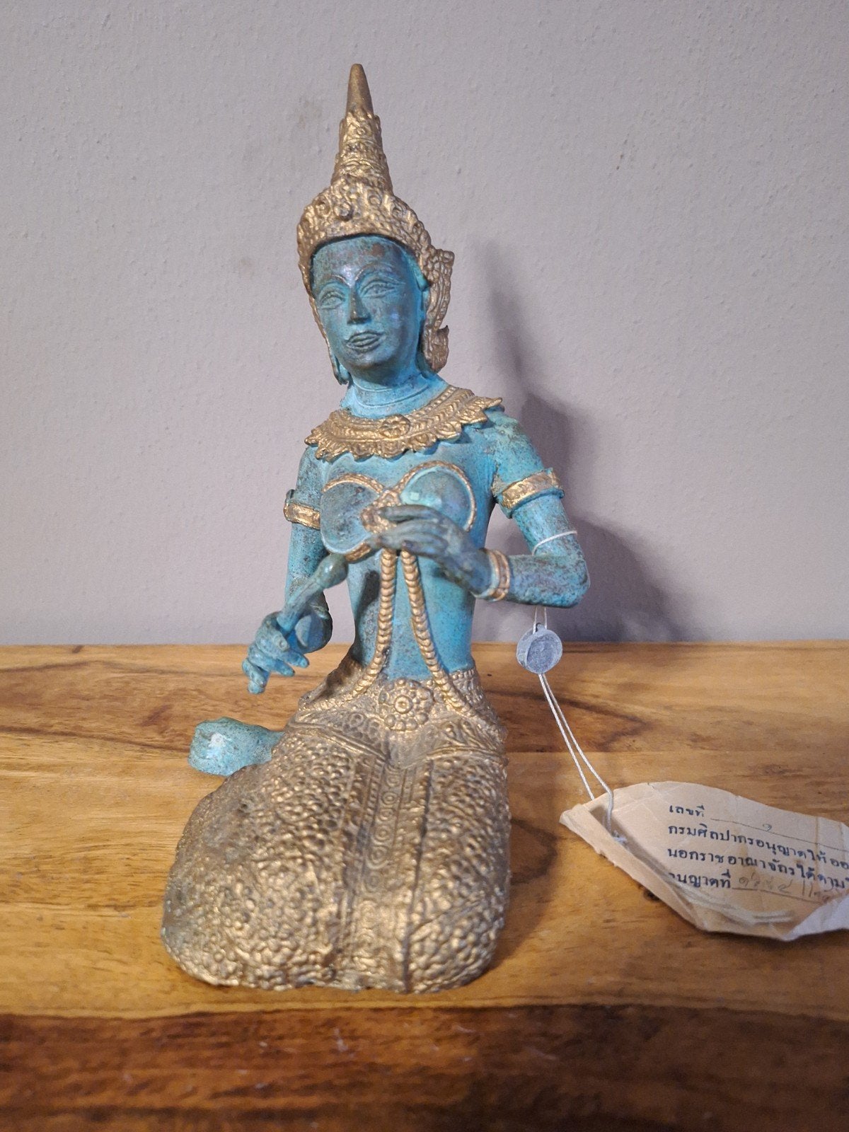 Thais bronzen beeldje, Ophalen