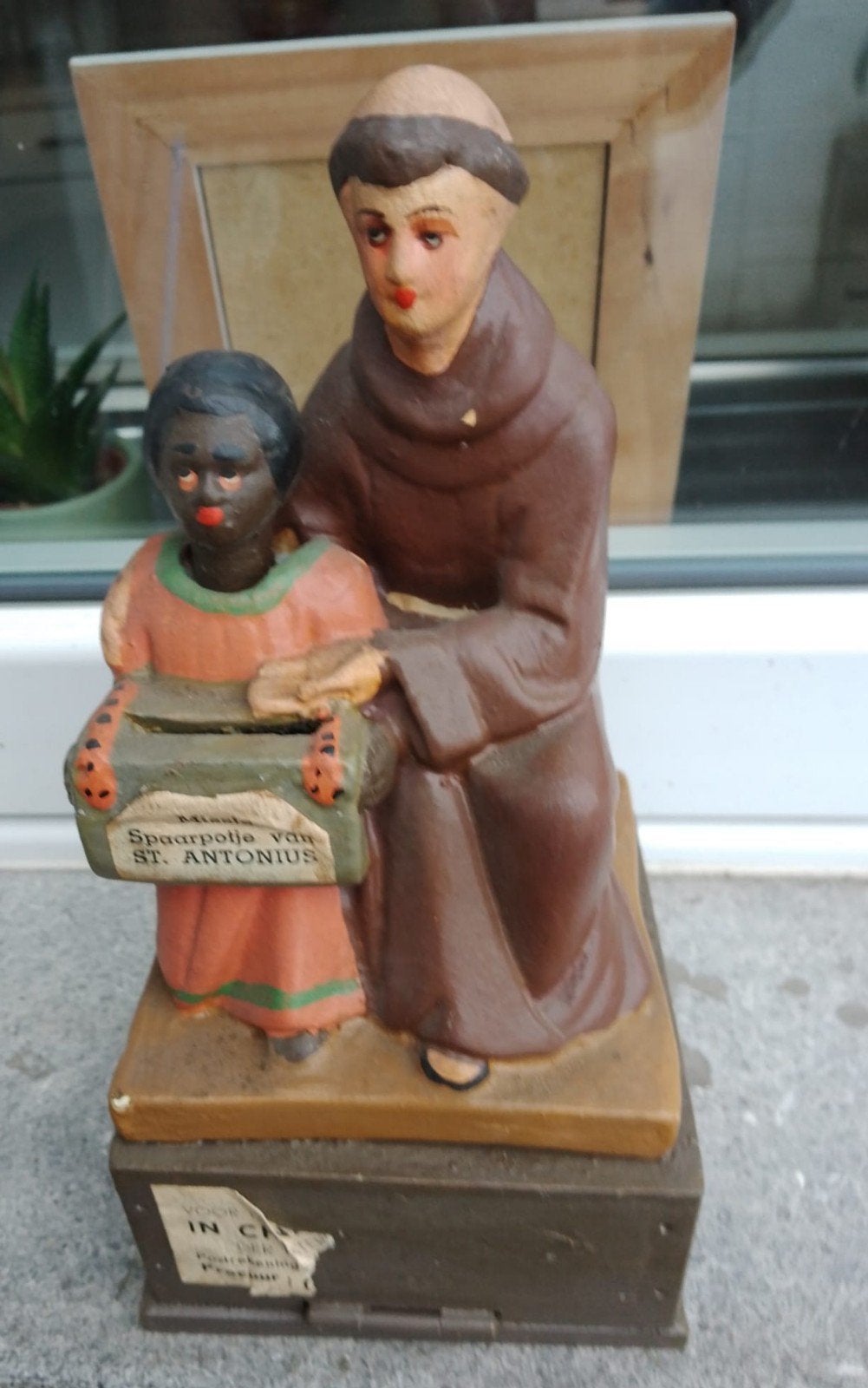 oud missionaris beeld spaarpot, Ophalen