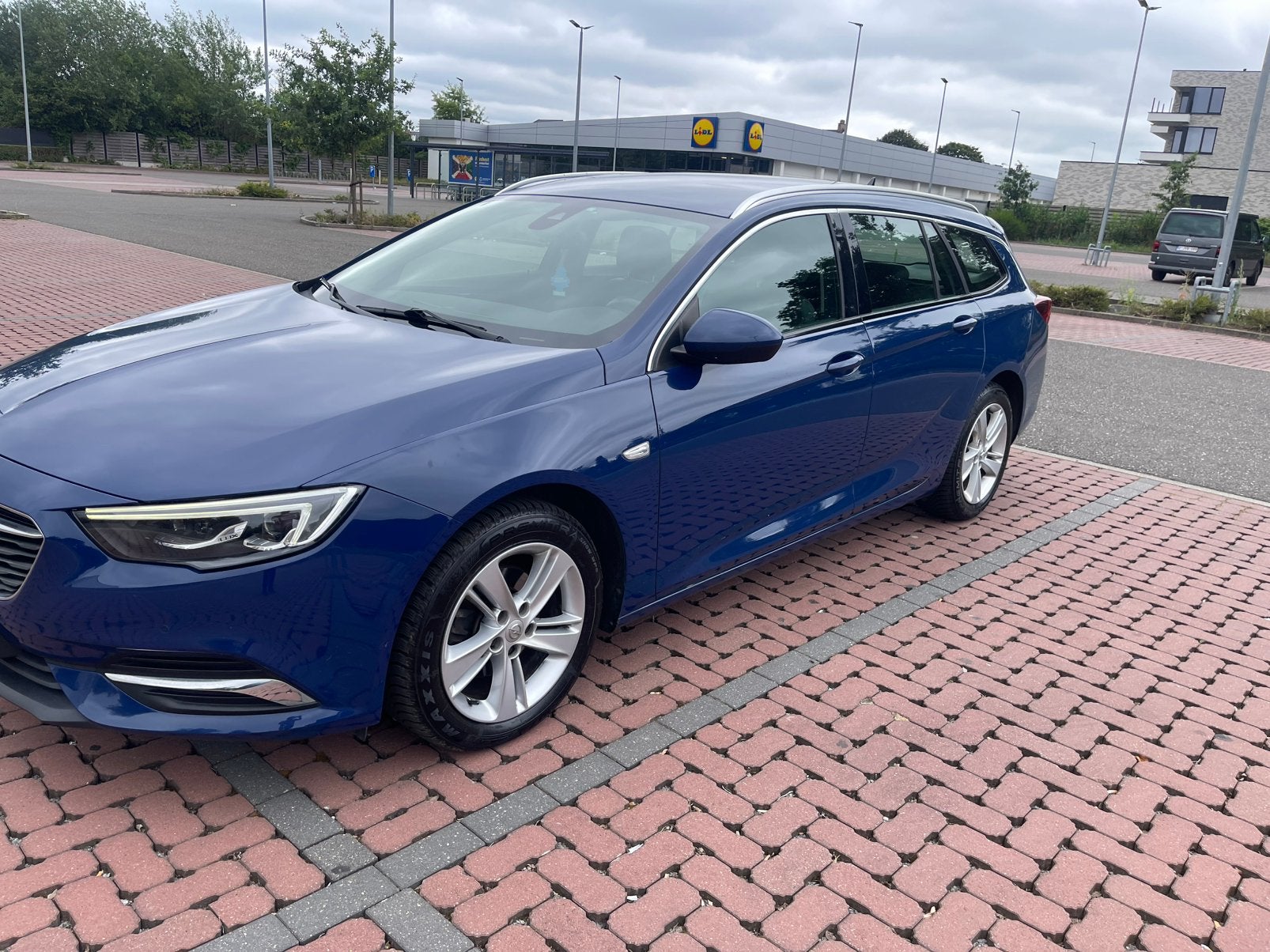 insignia sport tourer 1.6 ecoflex bj 201@, Auto's, Voorwielaandrijving, Blauw, Leder en Stof, 5 deurs